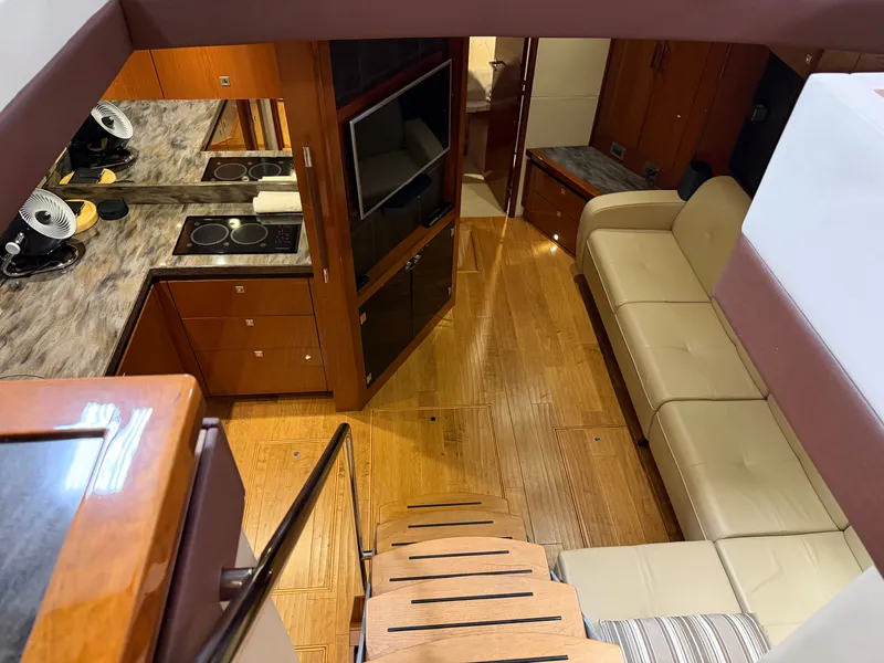 Slide: The Image of Interior of 2015 Sea Ray Sundancer 510 yacht with kitchen and sofa. - 19