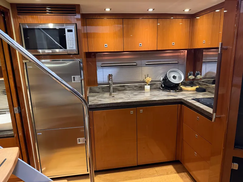 Slide: The Image of Interior of 2015 Sea Ray Sundancer 510 yacht kitchen. - 21