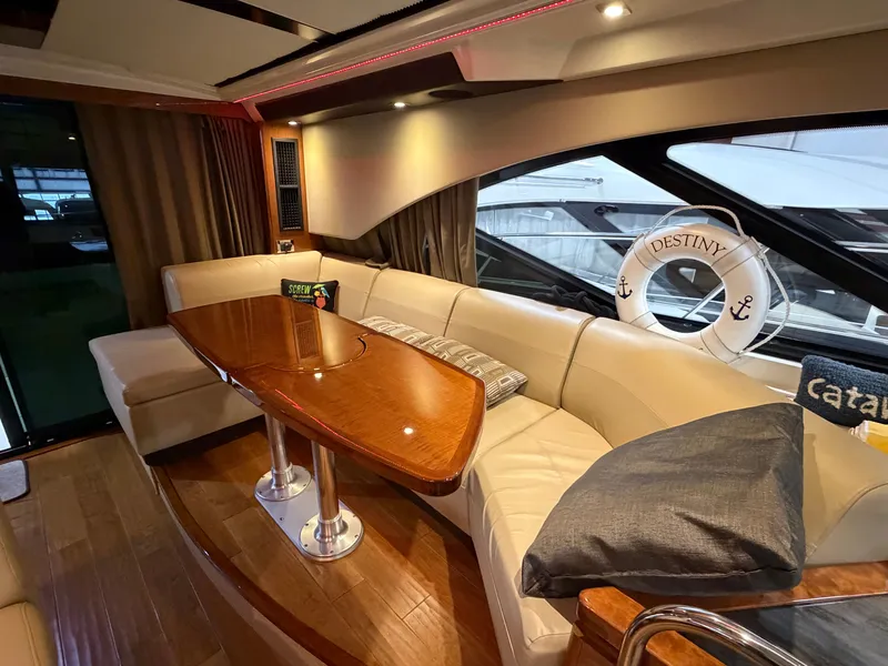 Slide: The Image of Interior of a 2015 Sea Ray Sundancer 510 yacht with elegant seating area. - 36