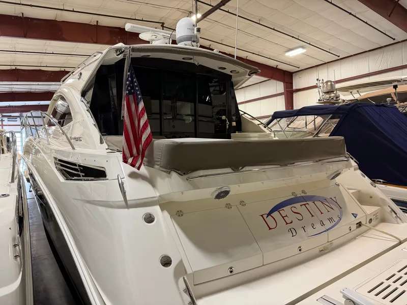 Slide: The Image of 2015 Sea Ray Sundancer 510 yacht in warehouse with US flag. - 7