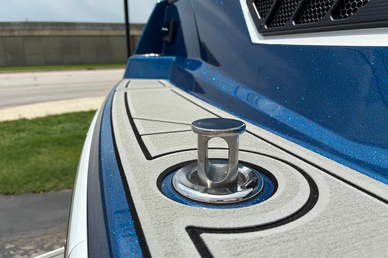 Slide: The Image of 2026 Moomba Tykon boat with metallic blue finish and sleek deck design. - 10