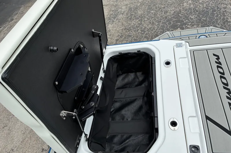 Slide: The Image of Open storage compartment on 2026 Moomba Tykon boat, showcasing interior details. - 15