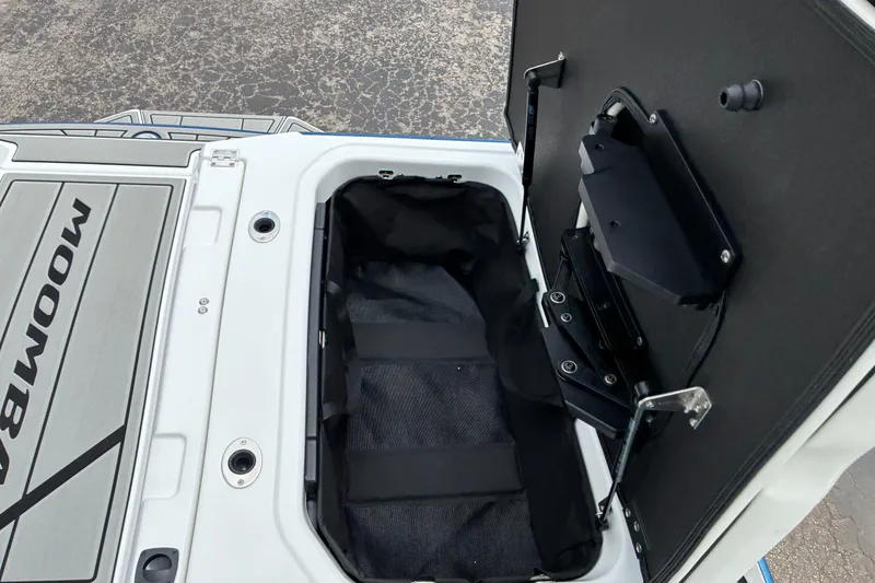 Slide: The Image of Open storage compartment in 2026 Moomba Tykon boat, showcasing interior design and functionality. - 16