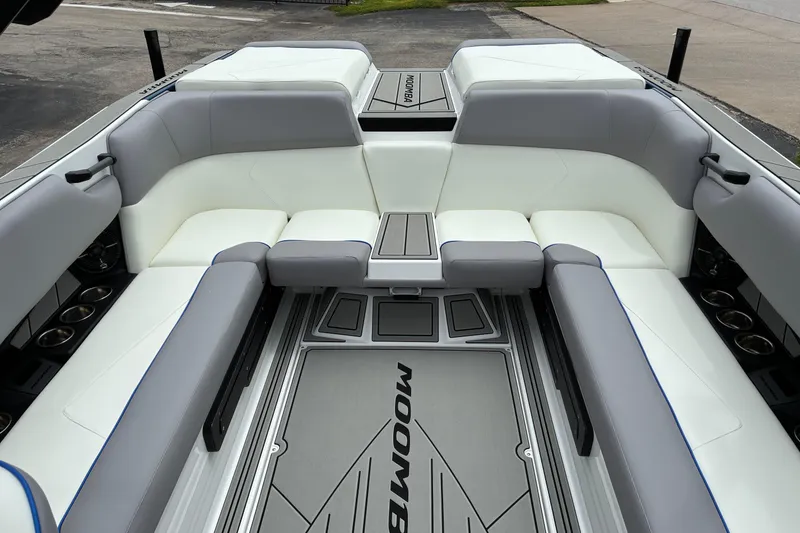 Slide: The Image of 2026 Moomba Tykon boat interior with sleek gray and white seating. - 18