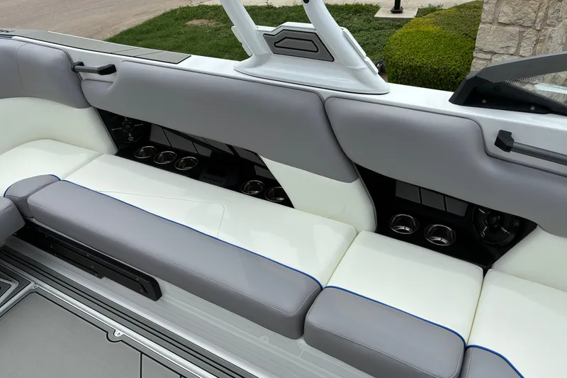 Slide: The Image of Interior seating of 2026 Moomba Tykon boat with cup holders and sleek design. - 20