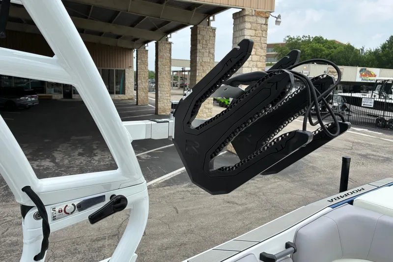 Slide: The Image of 2026 Moomba Tykon boat with advanced wakeboard rack and sleek design. - 21