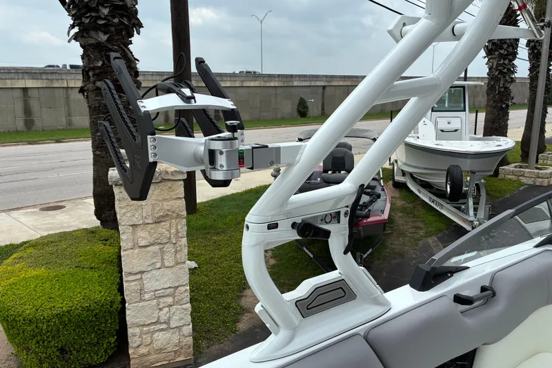 Slide: The Image of 2026 Moomba Tykon boat with advanced wakeboard rack and sleek design. - 23