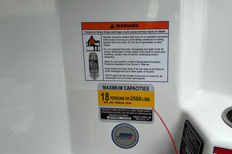 Slide: The Image of Warning and capacity labels on 2026 Moomba Tykon boat, maximum 18 persons or 2500 lbs. - 32