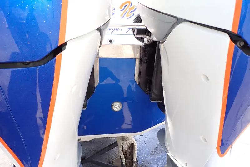 Slide: The Image of 2022 Deep Impact 369 Sport boat engine detail with blue and white design. - 101