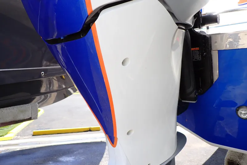 Slide: The Image of 2022 Deep Impact 369 Sport boat engine detail with blue and orange accents. - 104