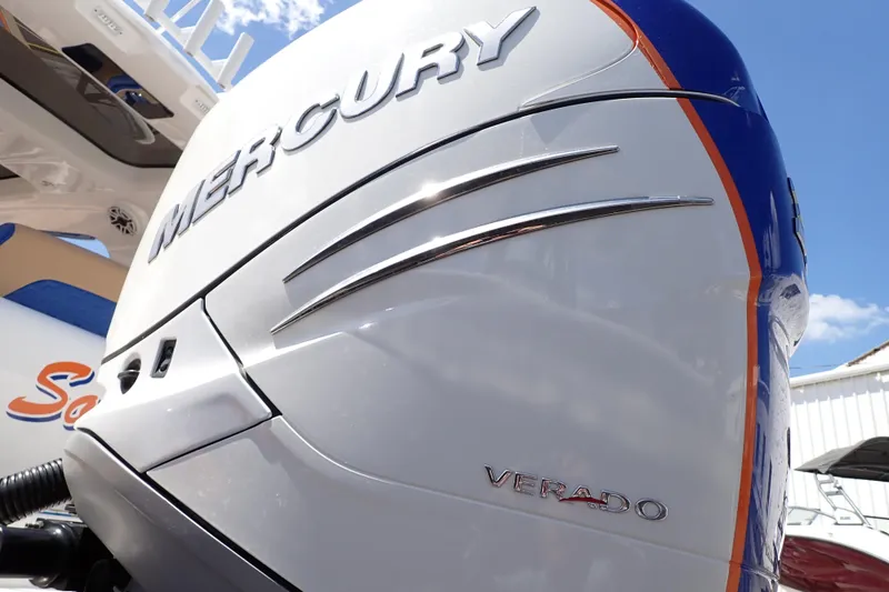 Slide: The Image of Mercury Verado engine on 2022 Deep Impact 369 Sport boat under clear blue sky. - 106