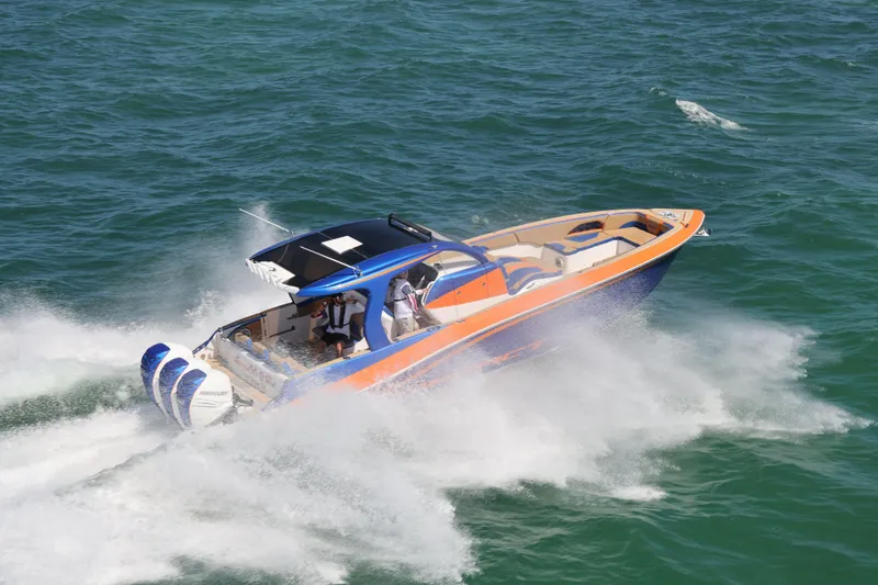 Slide: The Image of 2019 Deep Impact 369 Sport boat speeding on open water, showcasing powerful performance. - 17
