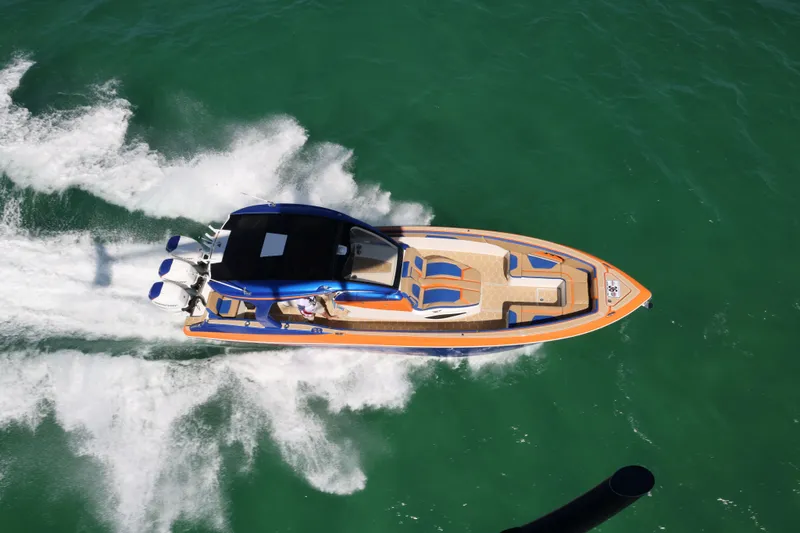 Slide: The Image of 2019 Deep Impact 369 Sport boat cruising on open water, aerial view. - 18