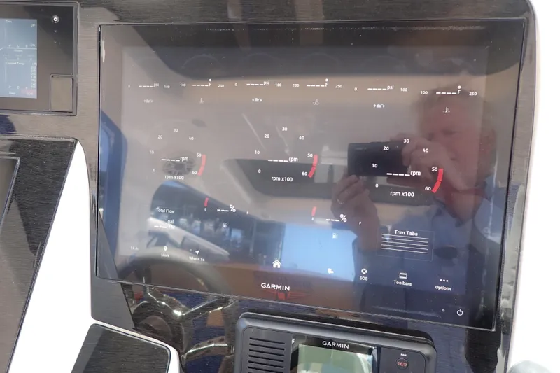 Slide: The Image of Dashboard of 2022 Deep Impact 369 Sport boat with Garmin display. - 26