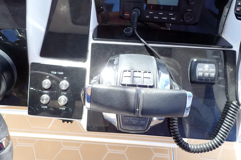 Slide: The Image of Control panel of 2022 Deep Impact 369 Sport boat with trim tabs and throttle. - 28
