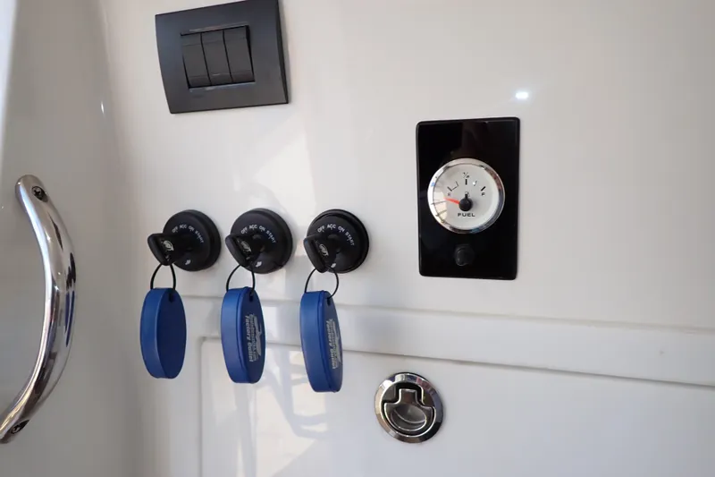 Slide: The Image of Control panel of 2022 Deep Impact 369 Sport boat with fuel gauge and ignition switches. - 36
