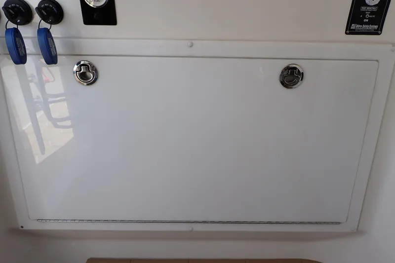 Slide: The Image of 2022 Deep Impact 369 Sport boat interior panel with key switches and controls. - 39