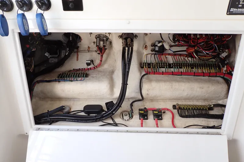 Slide: The Image of Electrical wiring and components inside a 2022 Deep Impact 369 Sport boat. - 41