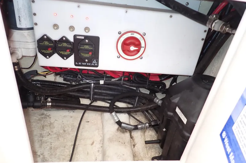 Slide: The Image of Electrical panel and wiring inside a 2022 Deep Impact 369 Sport boat. - 43