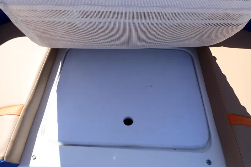Slide: The Image of Storage compartment on 2022 Deep Impact 369 Sport boat, featuring cushioned seating. - 49