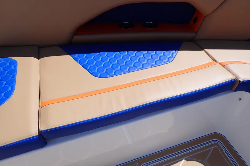 Slide: The Image of 2022 Deep Impact 369 Sport boat seating with blue and tan upholstery, hexagonal pattern. - 51