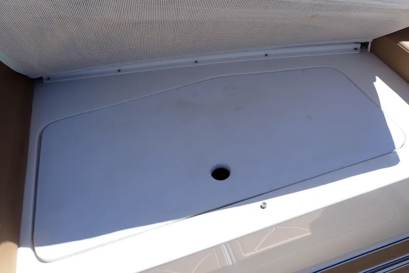 Slide: The Image of Storage compartment on a 2022 Deep Impact 369 Sport boat, featuring a white lid. - 52