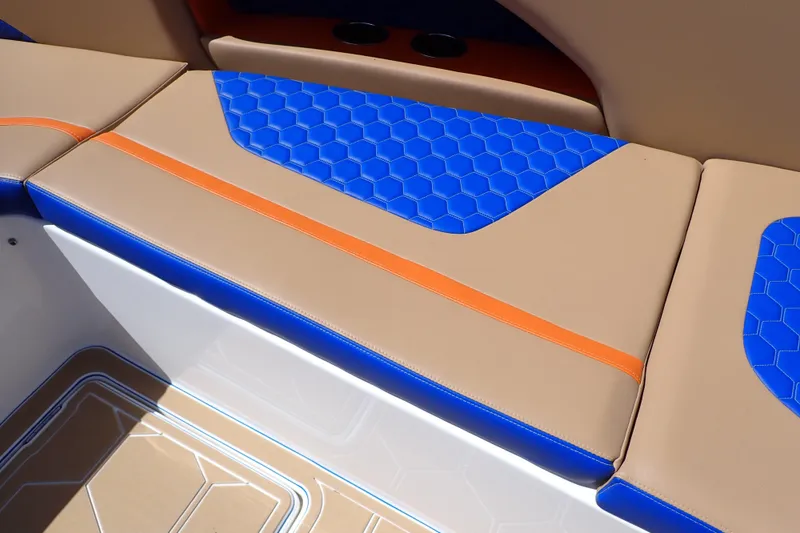 Slide: The Image of 2022 Deep Impact 369 Sport boat seating with blue hexagonal pattern and orange accents. - 54