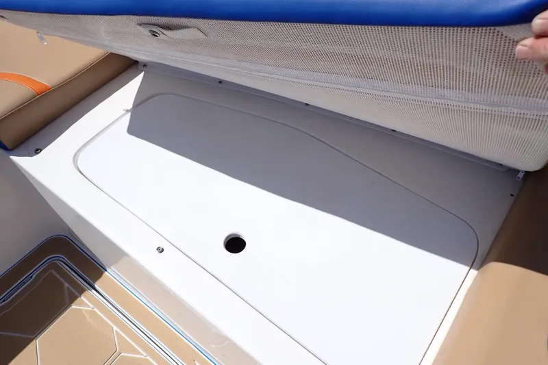 Slide: The Image of Storage compartment on 2022 Deep Impact 369 Sport boat, featuring cushioned seating. - 55