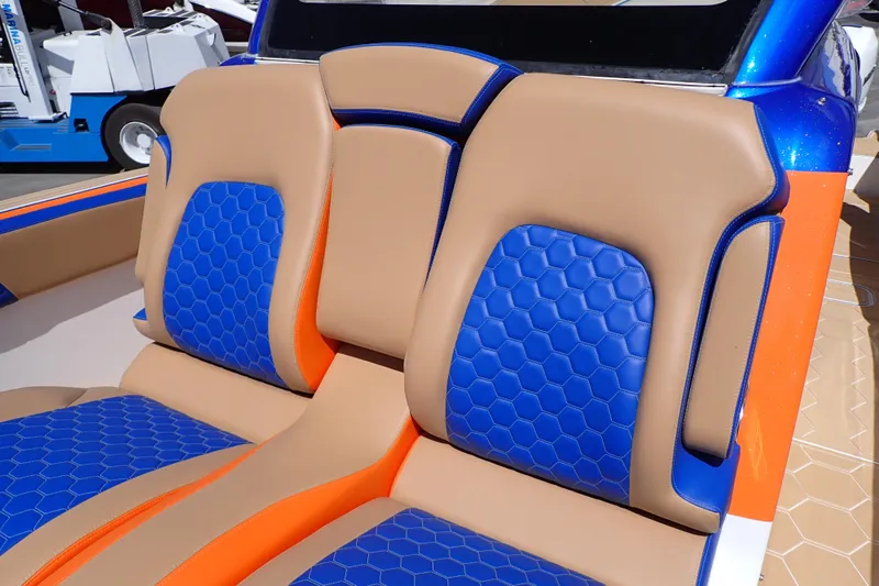 Slide: The Image of 2022 Deep Impact 369 Sport boat seats with blue and orange hexagonal pattern. - 57