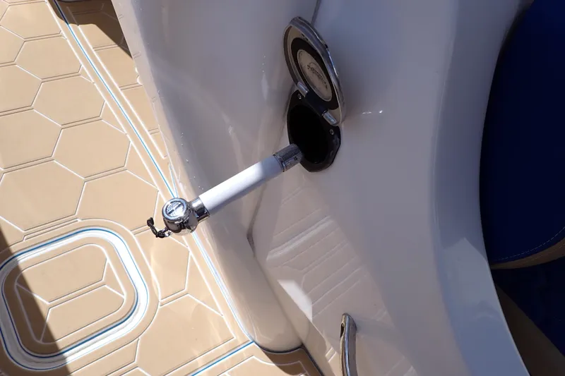 Slide: The Image of 2022 Deep Impact 369 Sport boat with a chrome fuel cap and beige deck. - 62