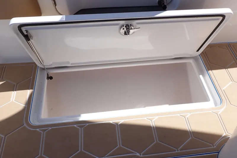 Slide: The Image of Open storage compartment on 2022 Deep Impact 369 Sport boat deck. - 66