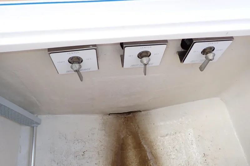 Slide: The Image of Control switches on a 2022 Deep Impact 369 Sport boat panel. - 68