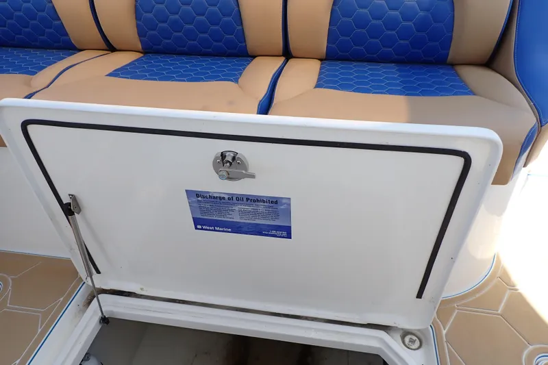 Slide: The Image of 2022 Deep Impact 369 Sport boat seat with storage compartment open. - 70