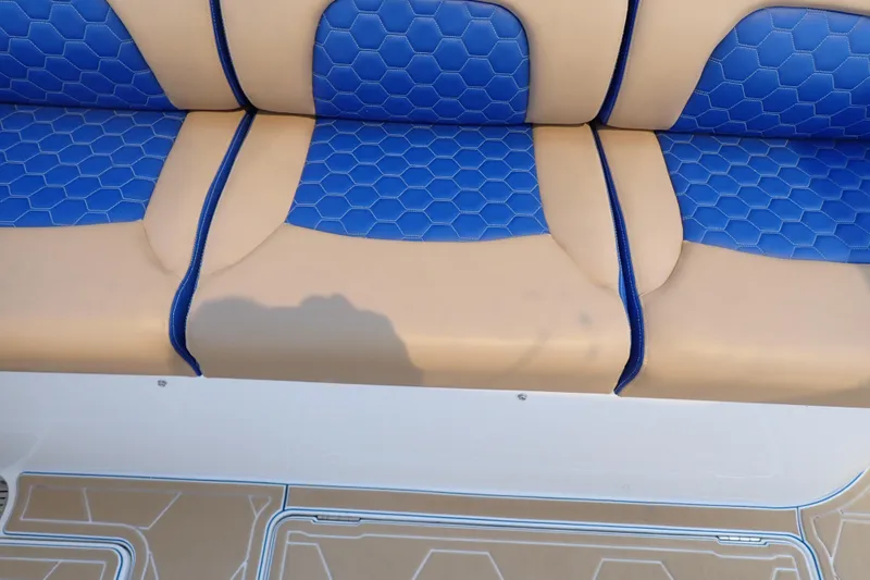 Slide: The Image of 2022 Deep Impact 369 Sport boat seat with blue hexagonal pattern and tan accents. - 71