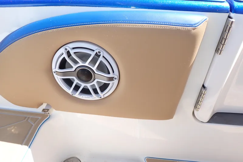 Slide: The Image of Speaker on 2022 Deep Impact 369 Sport boat, featuring tan and blue upholstery. - 78