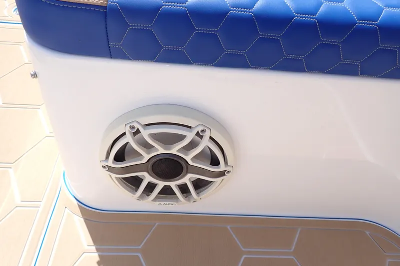 Slide: The Image of 2022 Deep Impact 369 Sport boat with blue hexagonal upholstery and JL Audio speaker. - 82