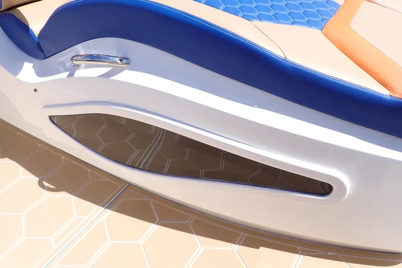 Slide: The Image of 2022 Deep Impact 369 Sport boat interior with blue and tan seating, hexagonal pattern flooring. - 85
