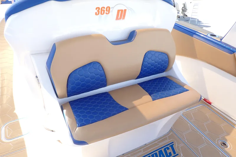Slide: The Image of Luxury seating on 2022 Deep Impact 369 Sport boat with blue and tan upholstery. - 9