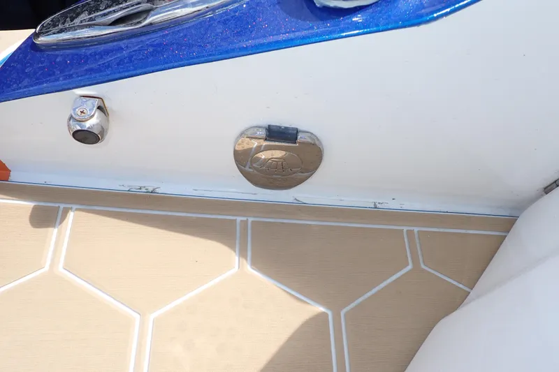 Slide: The Image of 2022 Deep Impact 369 Sport boat deck with blue and white detailing. - 90