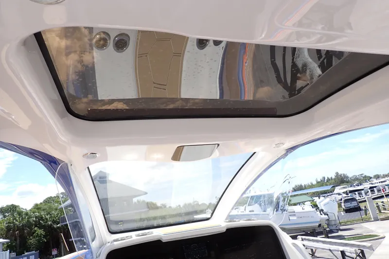 Slide: The Image of Interior view of 2022 Deep Impact 369 Sport boat with sunroof and clear skies. - 94