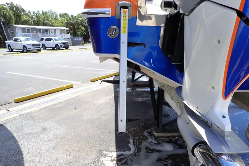 Slide: The Image of 2022 Deep Impact 369 Sport boat on trailer in parking lot. - 96