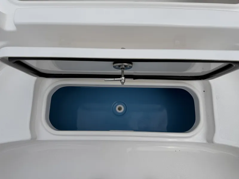 Slide: The Image of Tidewater 2210 Carolina Bay 2026, blue storage compartment in boat. - 25
