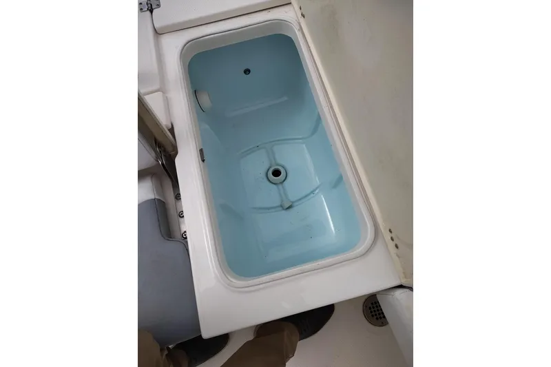 Slide: The Image of Livewell compartment on a 2021 Robalo 226 Cayman boat. - 13