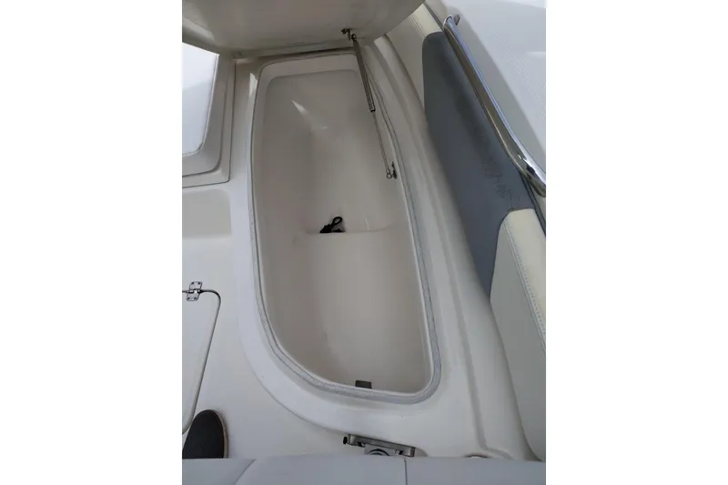Slide: The Image of Open storage compartment on a 2021 Robalo 226 Cayman boat. - 18