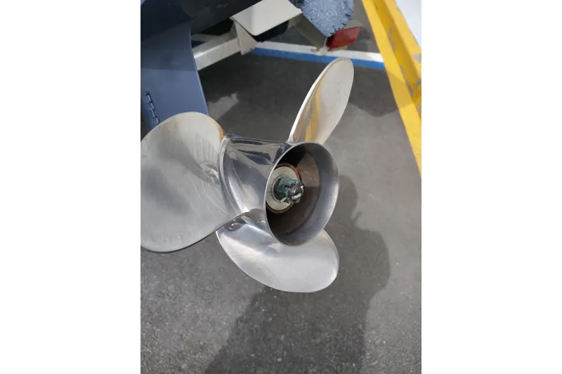 Slide: The Image of Propeller of 2021 Robalo 226 Cayman boat on pavement background. - 22