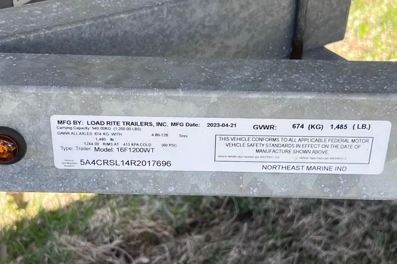 Slide: The Image of Label on Load Rite trailer, model 16F1200WT, showing specifications and compliance details. - 17