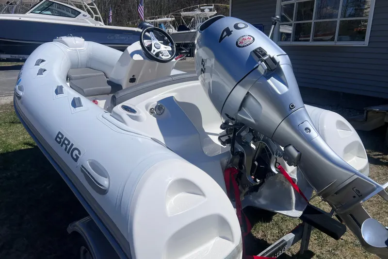 Slide: The Image of 2016 Brig Eagle 340 inflatable boat with a 40 HP outboard motor. - 4