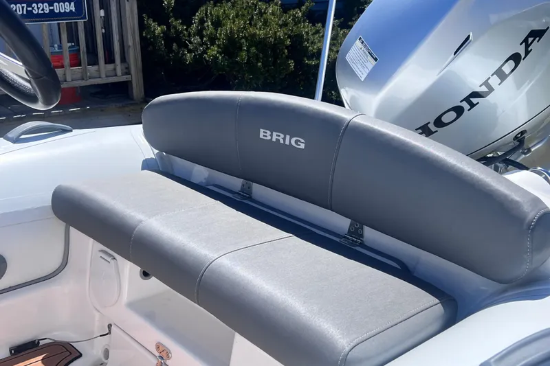 Slide: The Image of 2016 Brig Eagle 340 boat seat with Honda engine in sunlight. - 9