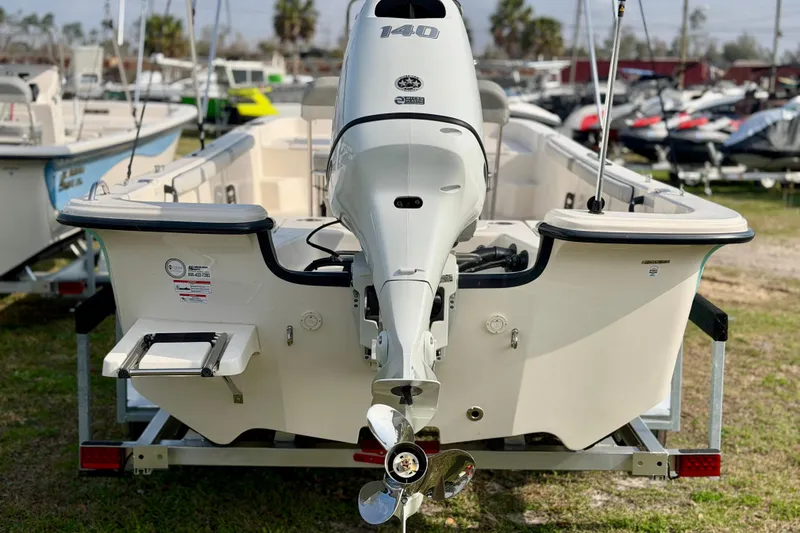 Slide: The Image of 2026 Carolina Skiff 21 LS boat with outboard motor, displayed on a trailer. - 5