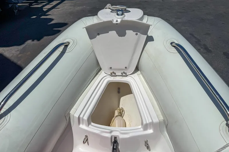 Slide: The Image of 2021 AB Inflatables Oceanus 14 VST boat with open storage compartment. - 15